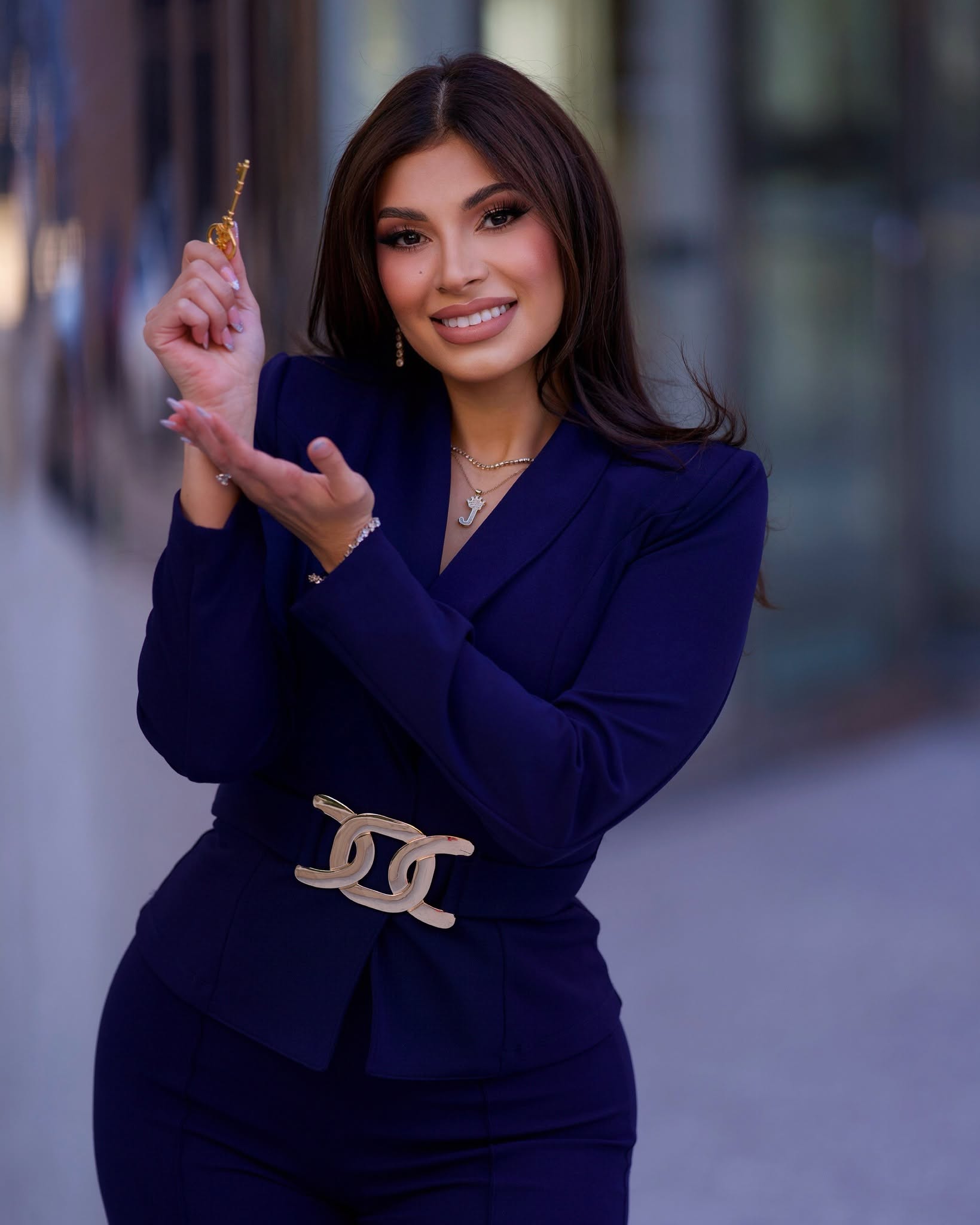 Jenny Portillo of Key to the City Real Estate holding a key